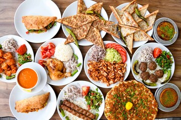 Delicious meat kebab with fresh vegetable salad served with variety of Turkish dishes and...