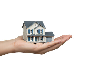 Hand holding a small house model isolated on transparent background
