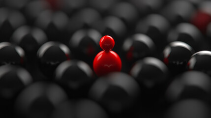 A single red figure stands out among many black figures