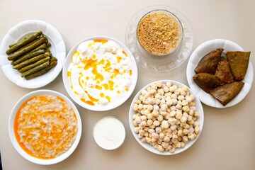 Delicious meat kebab with fresh vegetable salad served with variety of Turkish dishes and appetizers. Top view of assorted Turkish food and meze, tasty and healthy Mediterranean cuisine. Top view.