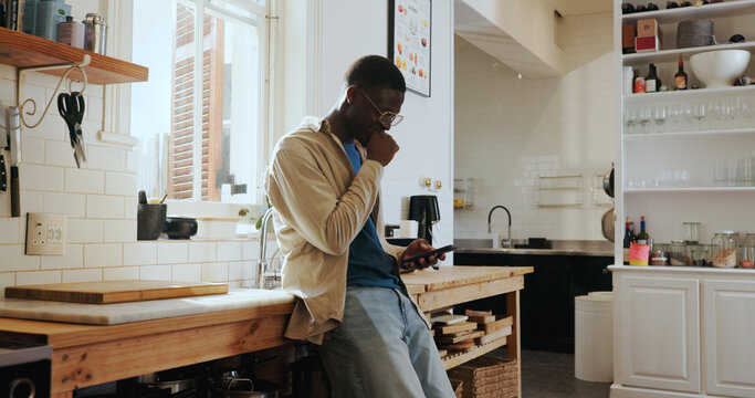 Scroll, reading and black man in kitchen with phone, funny social media post and laughing at text message. Happy, conversation and African person on mobile with internet comedy, meme or good news