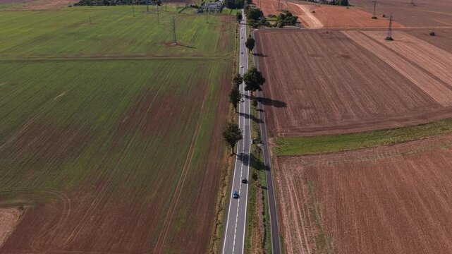 Road with moving cars from drone view. Road to the city of Svitavy in the Czech Republic