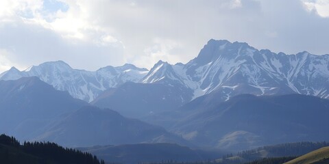 Snow capped mountain range with layers of blue hills and a cloudy sky mountains landscape