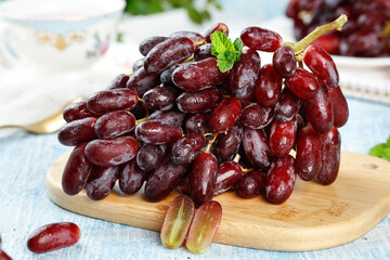 Fresh Red Grapes with Mint on Wooden Board - Healthy Fruit Display