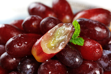 Fresh Red Finger Grapes with Golden Interior and Mint Leaf - Healthy Fruit Close-up