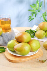 Fresh Sweet Mangoes on Wooden Cutting Board with Juice Glass and Natural Lighting