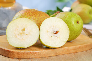Fresh Chinese Pears from Shaanxi Xinjiang Provinces Sliced on Wooden Board Showing Sweet Crisp White Flesh