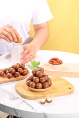 Fresh Macadamia Nuts Display with Milk Bottle on Wooden Boards - Healthy Natural Ingredients