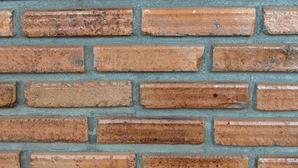 A textured red brick wall. Background.