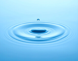 Macro Shot of Droplet Falling into Water with Concentric Ripples and Waves