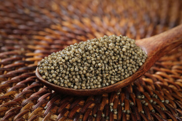 Organic Millet Grains in Wooden Spoon - Traditional Shanxi Black Millet for Healthy Porridge and Cooking