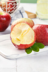 Fresh Red Apples with Dew Drops on White Cutting Board - Healthy Fruit Kitchen Scene