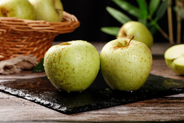 Fresh Green Apples with Water Droplets on Slate Board - Healthy Organic Fruit from Shandong