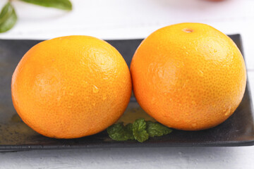 Fresh Ehime Oranges on Black Slate with Mint - Premium Japanese Citrus Fruit