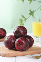 Fresh Mangosteen Tropical Fruits from Thailand Yunnan on Wooden Board with Orange Juice