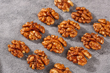 Fresh Walnut Kernels from Xinjiang Yunnan China Healthy Nuts Amber Shells Gray Background