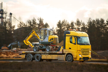 Construction machinery hauled by transport truck