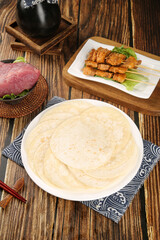 Asian Flatbread with Grilled Meat Skewers and Raw Beef on Wooden Table Traditional Cuisine