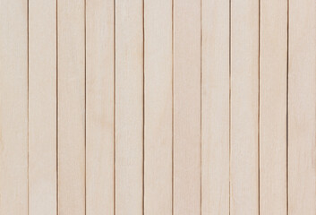 Smooth light wooden planks arranged in vertical pattern, natural texture for interior, flooring, or...