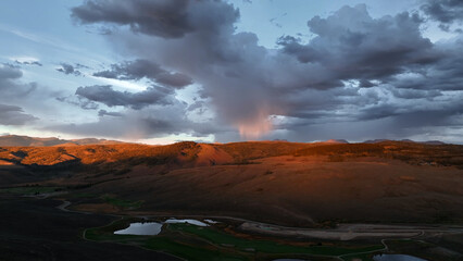 Beautiful drone sunset storm view over mountains at in Colorado fall