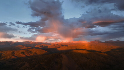 Fototapeta premium Beautiful drone sunset storm view over mountains at in Colorado fall