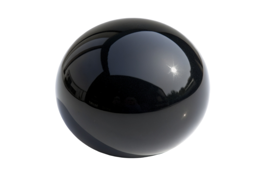 Glossy black sphere with reflective surface reflecting sunlight and clear sky in elegance and mystery