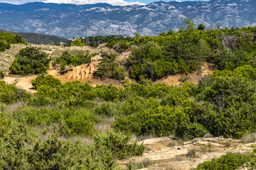 Sand dunes, rock formations, and a trail leading to the FKK Ciganka naturist beach on the island of Rab