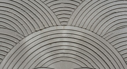 Grey wall with decorative arch design texture cement surface