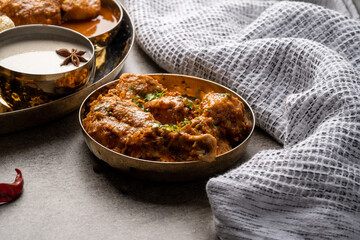 Chicken Kohlapuri is spicy Maharashtrian delicary of tender boneless chicken cooked with aromatic roasted ground spices and coconut. India food.
