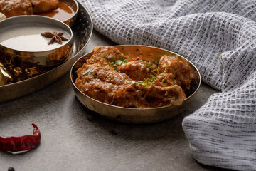 Chicken Kohlapuri is spicy Maharashtrian delicary of tender boneless chicken cooked with aromatic roasted ground spices and coconut. India food.
