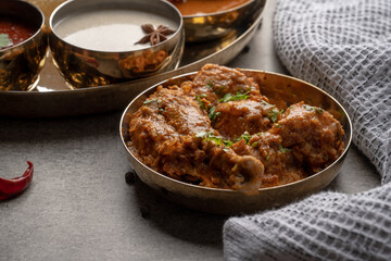 Chicken Kohlapuri is spicy Maharashtrian delicary of tender boneless chicken cooked with aromatic roasted ground spices and coconut. India food.