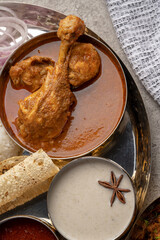 Chicken Kohlapuri is spicy Maharashtrian delicary of tender boneless chicken cooked with aromatic roasted ground spices and coconut. India food.