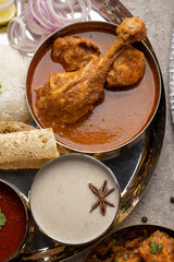 Chicken Kohlapuri is spicy Maharashtrian delicary of tender boneless chicken cooked with aromatic roasted ground spices and coconut. India food.