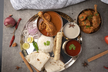 Kolhapuri chicken Thali is a popular Indian asian food platter consists of poultry meat, chikan...