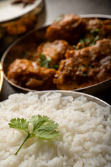 Kolhapuri chicken Thali is a popular Indian asian food platter consists of poultry meat, chikan sukka bhakri, rice, salad tambda padhra rassa 