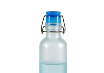 Isolated small bottle with blue stopper filled with water drops and condensation