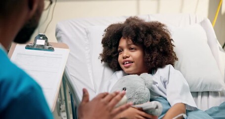 Doctor, consulting and child with clipboard in bed for healthcare checkup, diagnosis or results. Man, medical nurse or kid with teddy bear for health symptoms, questionnaire or survey in hospital - Powered by Adobe