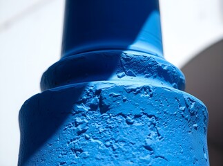 Vibrant Blue Stucco Column Grain Detail