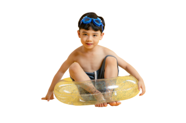 Asian kid A young boy sitting in a yellow inflatable tube, with swimming goggles on. A picture of a happy boy at summer. 