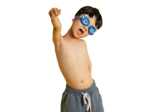 Asian kid A young boy wearing swim goggles and a casual outfit, raising his arm in excitement or playfulness. The background has PNG. - Powered by Adobe