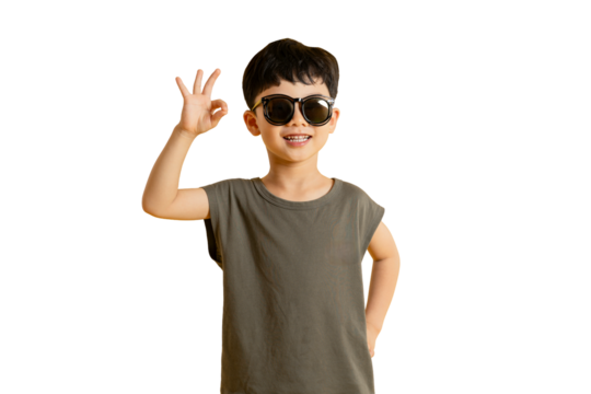 Asian young boy wearing sunglasses making an okay gesture and smiling, suggesting a positive outlook on PNG