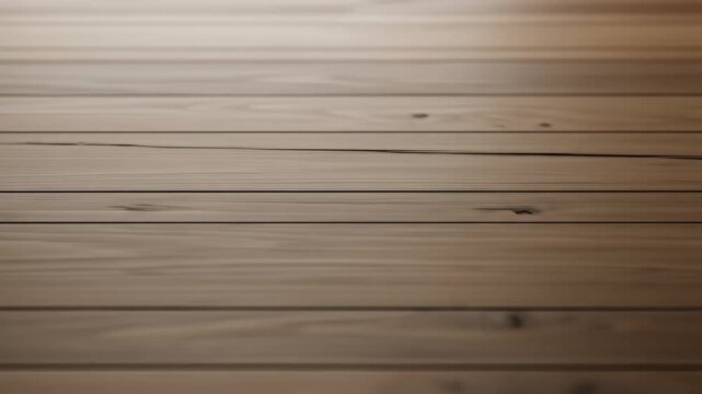 Close-up view of smooth wooden floorboards with natural grain patterns and warm lighting