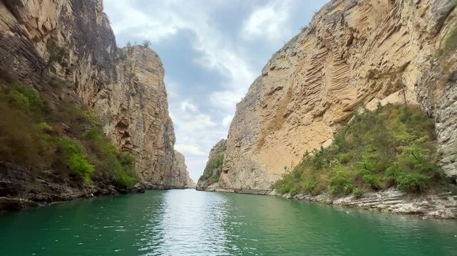 Emerald waters flowing between cliffs. Tourism concept.