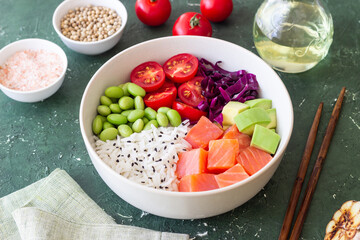 Poke bowl with rice, salmon, avocado, red cabbage, edamame and tomatoes. Healthy food. Diet.