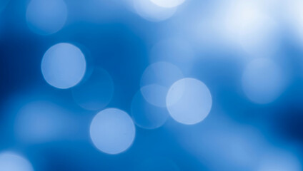 Obraz premium Abstract background with blue bokeh lights creating a soft and dreamy atmosphere, evoking calm serenity and a tranquil night sky with glowing tones.