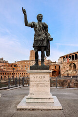 View of Statue of Roman Emperor Trajan at Roman Forum on famous Via dei Fori Imperial of Rome, Italy. Vertical photo. High quality photo