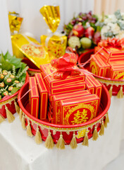 Traditional Vietnamese wedding gift trays with red cake boxes and double happiness symbol (囍)