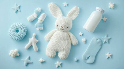 Baby shower setup with knitted bunny socks and milk bottle