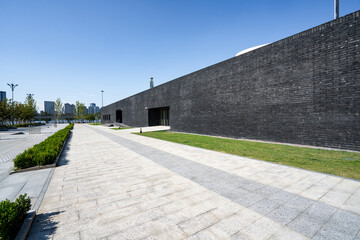 empty brick floor with modern building
