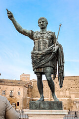 View of Statue of Roman Emperor Augustus Octavian at Roman Forum on famous Via dei Fori Imperial of Rome, Italy. Vertical photo. High quality photo